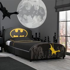 a batman themed bedroom with the moon in the background