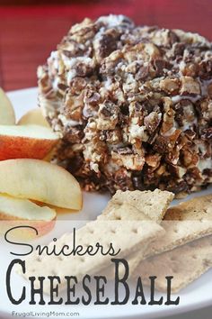 an apple and crackers cheese ball on a plate