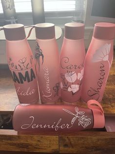 the pink bottles are labeled with names on them