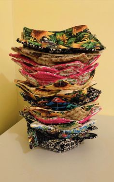 a stack of cloths sitting on top of a table