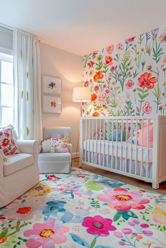 a baby's room with floral wallpaper and white furniture