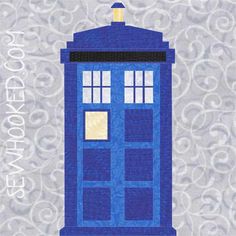 a blue phone booth sitting on top of a white and gray wallpaper with the word doctor who written in it