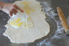 a person is making food on a pan with flour and eggs in the process of being made