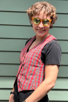 Fab vintage handmade vest in a bright red, green blue, black, white, and yellow plaid - great for adding a punch to an everyday outfit and for holiday parties!  Very good vintage condition with no marks or holes.  Approximate garment measurements laid flat (all measurements in INCHES): across shoulders: 10.5 across armpits: 17.5 front collar to bottom: 14   back collar to bottom: 22 across bottom: 17.5 Note that our shipping prices include tracking, insurance, and assume "worst-case" - i.e., to the West Coast from our East Coast shop - we refund overestimations on shipping as per our Shipping Policies.  We ship to most countries - convo us for combined or non-US shipping rates. For more fab vintage clothes and shoes, check out the rest of our shop:  https://grooveclothing.etsy.com  Follow Fitted Plaid Cotton Vest, Red Cotton Retro Vest, Red Retro Cotton Vest, Retro Red Cotton Vest, Fitted Red Retro Vest, Fitted Retro Red Vest, Retro Red Fitted Vest, Handmade Vest, Christmas Vest