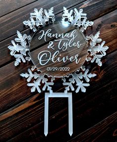 a snowflake shaped sign on the side of a wooden wall that says, hanny and alex's silver wedding