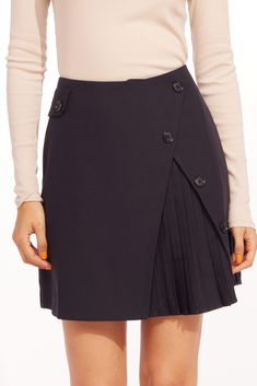 Be on-trend in this tailored mini skirt in dark navy with a split front and pleated peekaboo details. Polyester, rayon, spandex; polyester, spandex lining Button detail Back zip Hand wash Imported Dimensions 35"L Yellow Mini Skirt, White Striped Skirt, Printed Pleated Skirt, Anthropologie Skirt, Bubble Skirt, Sequin Mini Skirts, Hem Skirt, Stripe Skirt, Casual Skirt