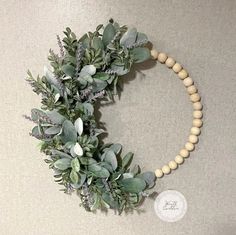 "This handmade wreath is a beautiful piece of decor that is perfect for adding a touch of elegant greenery to any space. The wreath pictured is crafted from faux lambs ear and lavender greenery on a wooden bead wreath base. This wreath can be displayed on your front door, entryway, fireplace mantle, and anywhere in between! Wreaths are also great gifts to give at any time of the year. The wreath pictured is approximately 18 inches in height by 18 inches in width. There is also a 20 inch, 22 inch, and 24 inch option available. All measurements are taken top to bottom and side to side so a 20\" x 20\" wreath measures 20 inches top to bottom and 20 inches side to side. Each wreath is handmade by me; slight variations may occur. I recommend keeping wreaths out of direct weather conditions as b Wooden Bead Wreath, Modern Farmhouse Wreath, Bead Wreath, Spring Lambs, Spring Wreath For Front Door, Front Door Entryway, Lambs Ear Wreath, Mardi Gras Wreath, Purple Spring