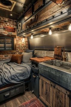 an old camper has been converted into a bed and kitchen area with wood floors