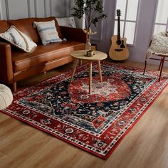 a living room filled with furniture and a rug