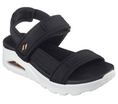 Heat up the season with style in Skechers Uno - Summer Stand2. This vegan T-strap sandal inspired from our iconic Uno silhouette features a debossed nylon upper with an adjustable slingback strap. This design is complete with a cushioned Yoga Foam footbed and a visible Skech-Air airbag midsole. | Skechers Women's Uno - Summer Stand2 Sandals | Medium Width | Skech-Air visible airbag midsole | Yoga Foam cushioned comfort footbed | Crafted with 100% vegan materials | Embossed nylon upper with adjus Sporty Sandals With Adjustable Strap For Summer, Adjustable Open Toe Nylon Sandals, Adjustable Nylon Open Toe Sandals, Adjustable Fit Open Toe Synthetic Sandals, Open Toe Synthetic Sandals With Adjustable Fit, Sporty Double Strap Sandals For Summer, Summer Nylon Sandals With Arch Support, Spring Sandals With Cushioned Adjustable Fit, Spring Sandals With Cushioned Footbed And Adjustable Fit