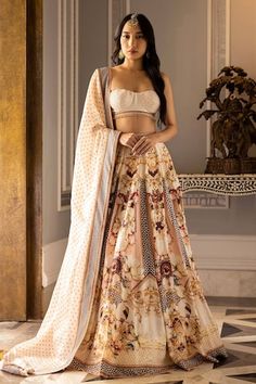 Ivory based, multicoloured lehenga with printed regal and floral motifs. The lehenga skirt is paired with a cropped blouse having crystals, sequins and tassels, and a bordered organza dupatta. - Aza Fashions Bohemian Wedding Traditional Wear With Unstitched Blouse, Bohemian Lehenga With Motifs For Reception, Bohemian Lehenga For Reception With Traditional Drape, Bohemian Lehenga With Sheer Dupatta For Wedding, Bohemian Wedding Lehenga With Sheer Dupatta, Bohemian Sharara With Motifs For Reception, Fitted Bohemian Traditional Wear For Reception, Fitted Georgette Lehenga With Motifs, Bohemian Lehenga With Unstitched Blouse For Reception