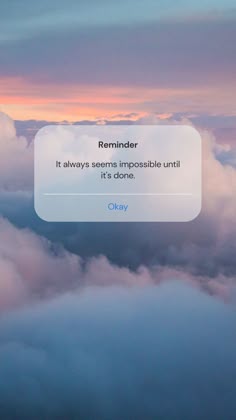 the text reads reminder it always seems impossible until it's done on top of clouds