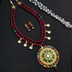 Indian Kundan Jewelry, Bollywood Jewelry, Navratan Stone Pendant Set, Wedding Designer Bridal Jewelry, Pakistani Jewelry, Latest Necklace The majestically handcrafted Kundan necklace set is the best to match Indian tradition and intricate work handcrafted by the artisans of India. The necklace is a masterpiece inspired by Indian jewelry to give you a royal look. The bold and bright design of the necklace is perfect for all the beautiful women * Necklace Length: 22 inches (comes with adjustable dori) * Earrings Length: 1 inch approx * Material: Brass and stone * Package: Necklace And Earring STYLE TIP: This piece of elegant jewelry goes well with all your modern as well as traditional outfits. Best match for your wedding outfits ABOUT US: Jaipri makes each piece of its product by learning t Kundan Necklace With Stone Work, Traditional Kundan Beaded Necklace, Wedding Temple Necklace With Cutdana And Round Beads, Festival Bridal Necklace With Cutdana, Cutdana Bridal Necklace For Festivals, Festive Round Bridal Necklace For Puja, Festive Kundan Bridal Necklace With Round Beads, Traditional Kundan Bridal Necklace With Round Beads, Festive Bridal Kundan Necklace With Round Beads