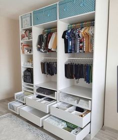 an organized closet with drawers and clothes