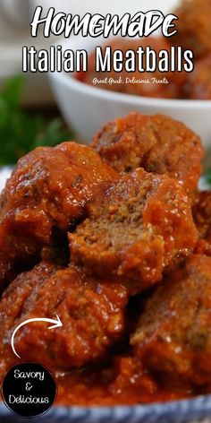 homemade italian meatballs in a blue and white bowl with parsley on the side