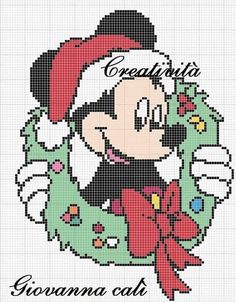 a cross stitch mickey mouse with christmas wreath