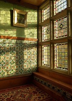 stained glass windows in the corner of a room