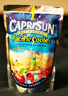 a bag of caprisun pacific cooler sitting on top of a wooden countertop