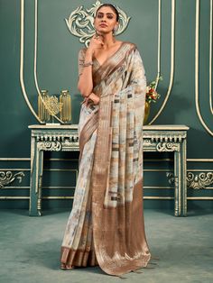 This exquisite saree is a perfect choice for all your upcoming festivals, events, and special occasions. Made from high-quality cotton fabric, this saree features a digital print work in an off-white and brown color combination, giving it a unique and elegant look.
The rich weaving pallu with a weaving border adds a touch of sophistication to the saree, making it a standout piece in your collection. The accompanying brown cotton blouse with zari weaving work perfectly complements the saree, comp Lehenga Crop Top, Angrakha Style, Lehenga Choli Wedding, Party Wear Lehenga Choli, Bollywood Lehenga, Cotton Wedding, Party Wear Lehenga, Casual Saree, Bridal Lehenga Choli