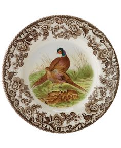 a plate with two pheasants on it