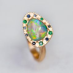 Shades of Ocean Opal Eclipse Ring – Sarah Gardner Jewellery Luxury Blue Opal Ring, Unique Luxury Blue Opal Ring, Lightning Ridge, Black Opal, Opal Jewelry, Opal Rings, Shades Of Blue, Blue Sapphire, Vintage Jewelry