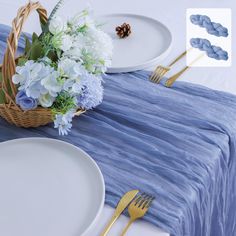 the table is set with blue and white flowers