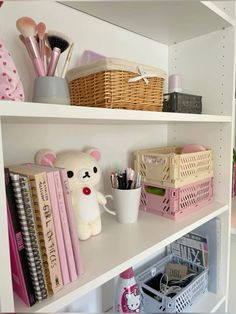 the shelves are filled with various items such as books, pens and pencils