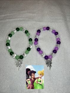 two beaded bracelets with disney characters on them, one is purple and the other is green