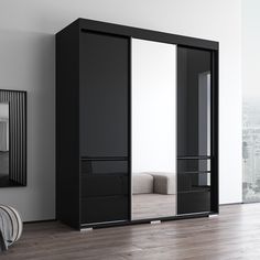 a black and white closet with mirrored doors in a room next to a mirror on the wall