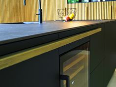 an empty counter top in a kitchen with fruit on it