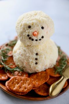 a snowman made out of rice on top of crackers