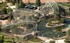 an aerial view of a park with many trees and plants in the middle of it