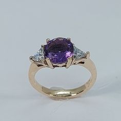 This stunning  style ring has been carefully crafted in warm 10k yellow gold , authentic amethyst and White Cubic Zirconia. Great for any occasion! Buy it for your-self or for someone you love! This beautiful ring will not go unnoticed. All of my jeweler is handmade from scratch and of high quality. A tracking shipping number will be provided to you once the ring has been mailed. Ring Measurements: Ring is size 5 1/2  but can be resized at no extra cost and will be shipped to you in an elegant g Heirloom 14k Gold Amethyst Ring With Accent Stones, Fine Jewelry Yellow Gold Amethyst Ring With Brilliant Cut, Heirloom Amethyst Rings With Accent Stones, Heirloom Purple Rings With Accent Stones, Heirloom Purple Diamond Ring, Yellow Gold Amethyst Round Cut Rings, Fine Jewelry Purple Rings With Brilliant Cut, Purple Brilliant Cut Rings For Promise, Classic Purple Diamond Ring With Accent Stones