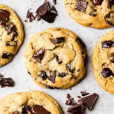 several chocolate chip cookies on a baking sheet