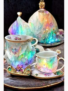 the tea set is decorated with iridescent colors