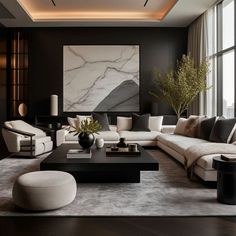 a modern living room with black walls and white couches, large painting on the wall