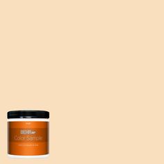 the behr paint color is shown in an orange hue, and it has a black lid