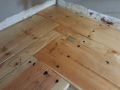 wood flooring being installed in the corner of a room