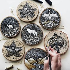 a person is working on some embroidery designs