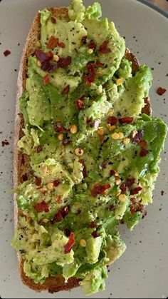 a white plate topped with an avocado toast