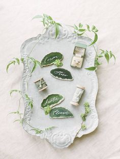 a white tray topped with lots of green items