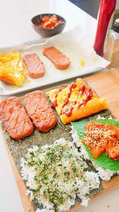 several different types of sushi on a cutting board