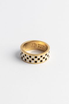 Introducing the Gambit Ring by Merchants of the Sun. Handcrafted in 18k gold vermeil with black and white enamel, this unisex band ring features a unique checker pattern, setting it apart from the crowd. Its watersafe design adds a touch of versatility. Embrace the allure of this distinctive and meticulously crafted piece of jewelry, a symbol of individuality and style. Elevate your look with the Gambit Ring, making a statement that is uniquely you. If time is spent, the Gambit is calculated. Ea The Gambit, Jewelry Necklace Simple, Gold Vermeil Jewelry, Bold Rings, Jewelry Minimalist, Pattern Ring, Dope Jewelry, Vermeil Jewelry, Enamel Ring