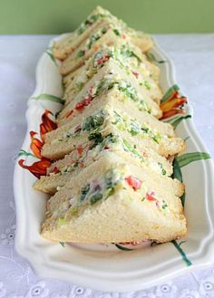 a white plate topped with sandwiches on top of a table