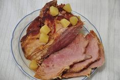 a plate with meat and potatoes on it