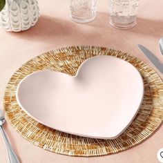 a heart shaped plate sitting on top of a table