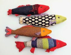 three knitted fish sitting on top of each other