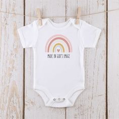 Made in gods image infant onesie Bible Verse Onesie, Playful Short Sleeve Bodysuit For First Birthday, Cotton Short Sleeve Onesie For First Birthday, Cute Short Sleeve Bodysuit For First Birthday, White Short Sleeve Onesie For First Birthday, White Short Sleeve Bodysuit With Letter Print, Playful Short Sleeve Onesie As A Gift, Playful Short Sleeve Onesie Gift, Playful Short Sleeve Onesie As Gift