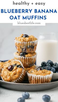 blueberry muffins on a plate next to a glass of milk