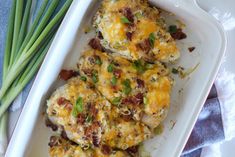 some green onions and eggs in a white casserole dish